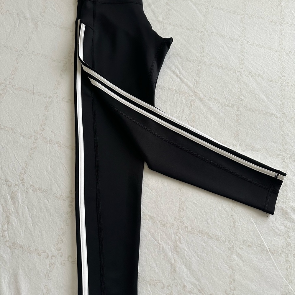 Adidas’s Black Women's Athletic Pants with Iconic White Stripes